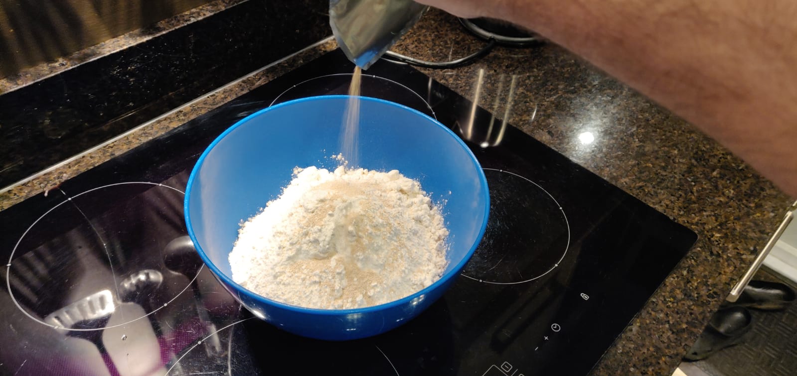 Adding the yeast to the bowl